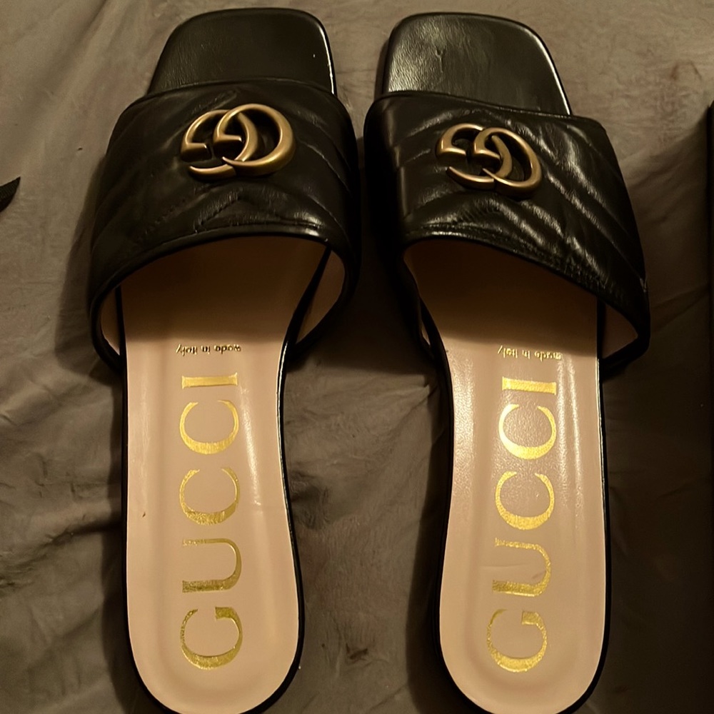 Never worn Gucci Marmont Slides in size 11. I suggest sizing down a size.